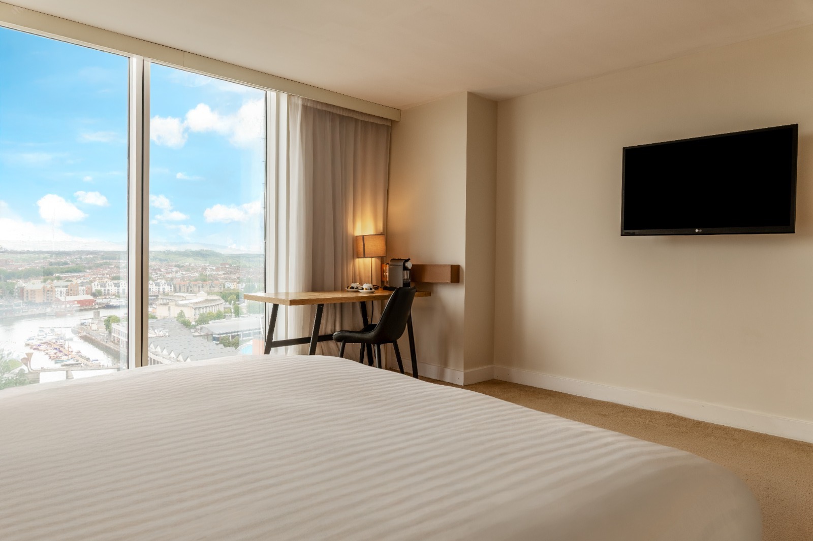 Spacious room with floor-to-ceiling windows